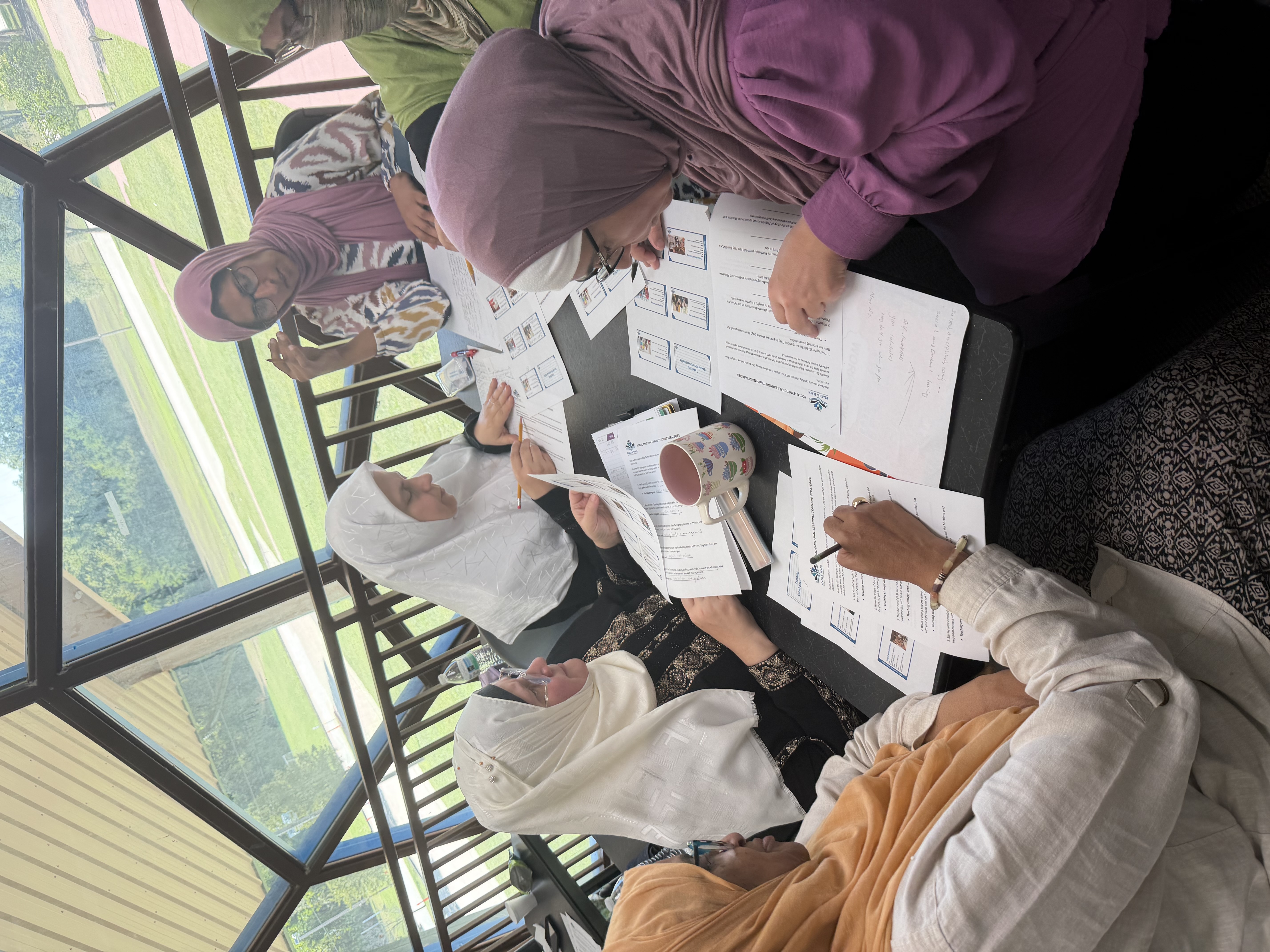 Teachers working through materials at a workshop